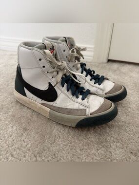 Nike White High-Top Sneakers with Black Swoosh and Navy Laces